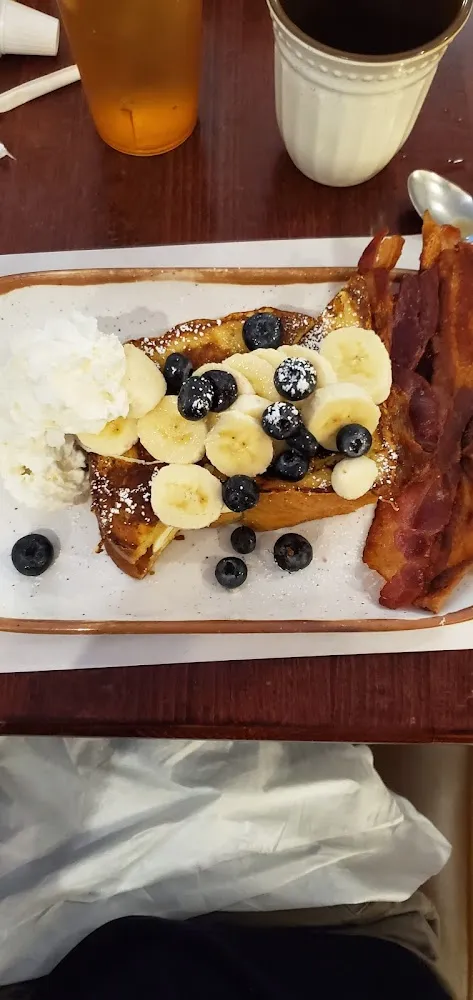 Cream Cheese Stuffed French Toast with Blueberries Bananas and Whipped Cream
